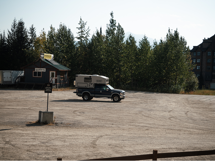 Car in parking lot forest